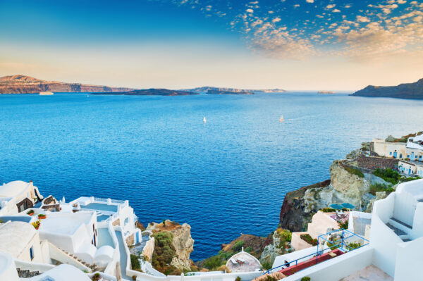 Beautiful view of the sea and islands at sunset. Oia town, Santorini island, Greece.